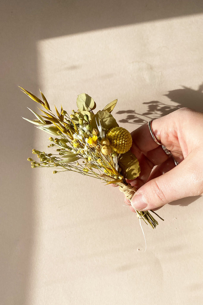 yellow and white and golden boutonniere